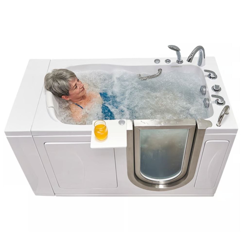 Senior woman relaxing in an Ella Royal walk-in tub with hydro massage jets and a drink on the swivel tray