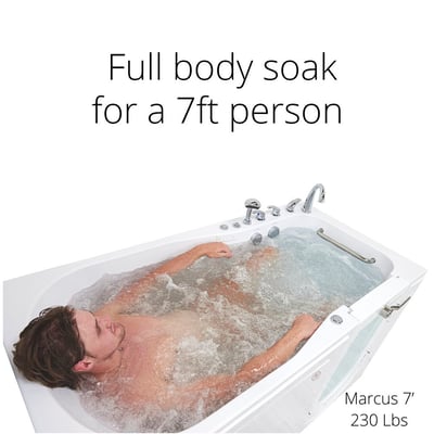 Tall man relaxing in a full body hydro massage soak inside the Ella Shak 36x72 walk-in tub with outward swing door