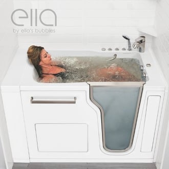 Woman reclining and enjoying a hydro massage soak inside the Ella Ultra walk-in tub with glass side door
