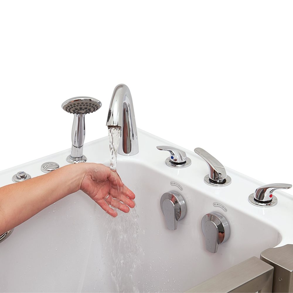 Hand testing warm water flowing from the chrome fast-fill faucet on an Ella Elite walk-in tub