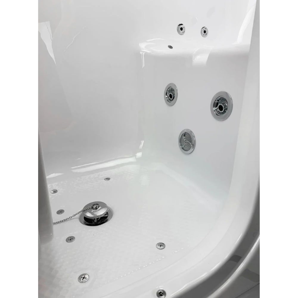 Vista interior de la bañera con puerta Ella S-Class, donde se aprecian los hidrojets cromados, los chorros de aire, el suelo texturizado y el desagüe