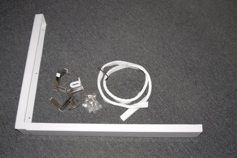 White L-shaped Ella extension panel kit with metal mounting brackets and hardware for walk-in tub alcove installation