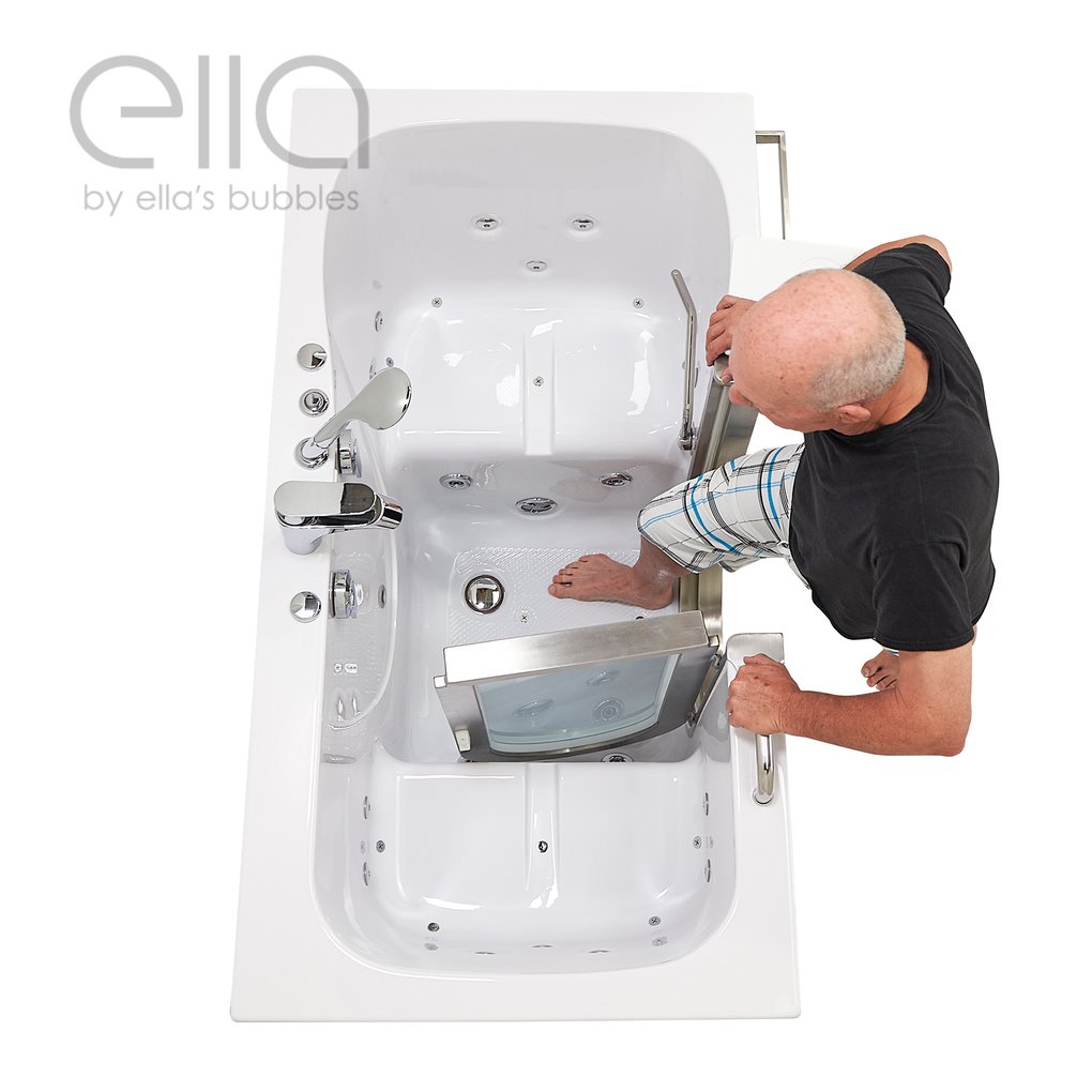 Senior man stepping into the Ella Companion two-person walk-in tub through the wide door with dual drain and hydro jets