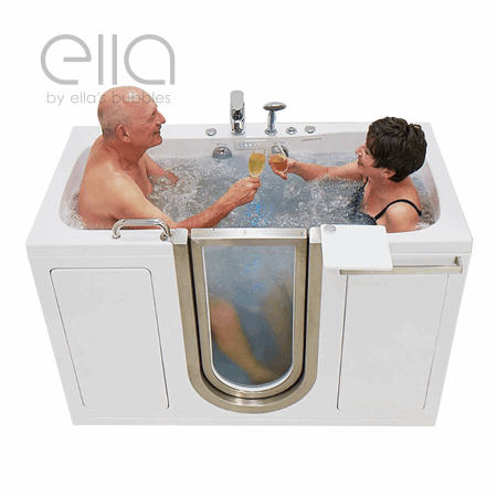 Senior couple toasting with champagne glasses while soaking together in the Ella two-seat walk-in tub with hydrotherapy jets