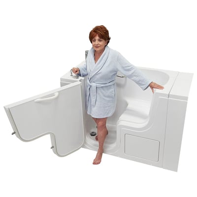 Senior woman in a blue robe stepping out of the Ella Transfer26 ADA accessible walk-in tub with outward swing door open
