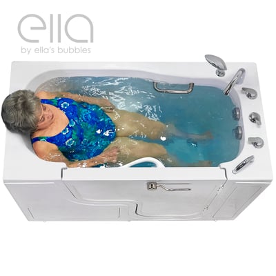 Senior woman relaxing in the Ella Transfer60 wheelchair accessible walk-in tub with hydro jets and chrome grab bar