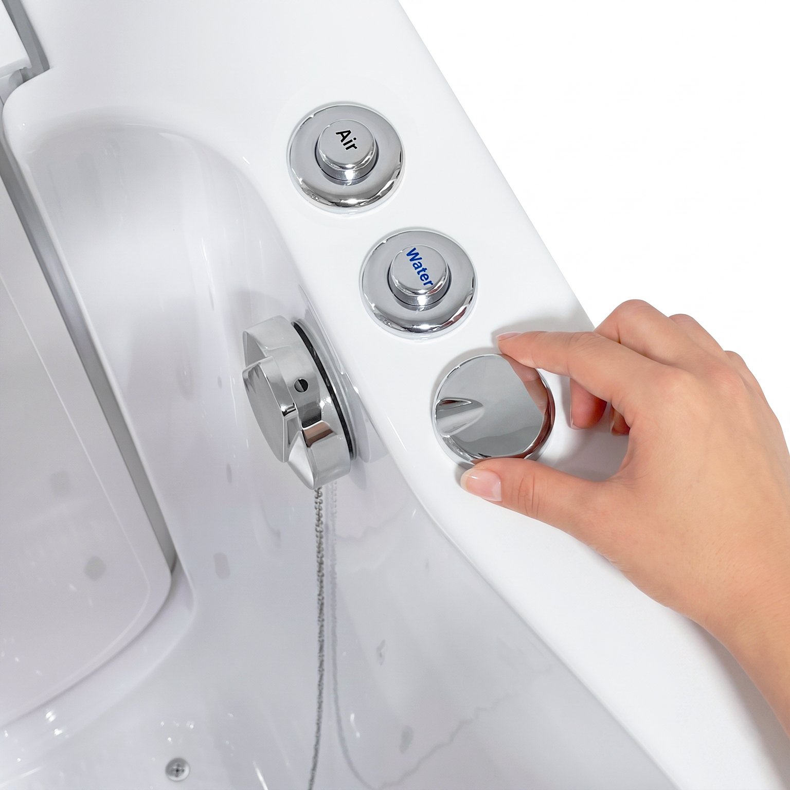 Hand turning the chrome intensity control dial on an Ella walk-in tub deck beside the Air and Water push buttons