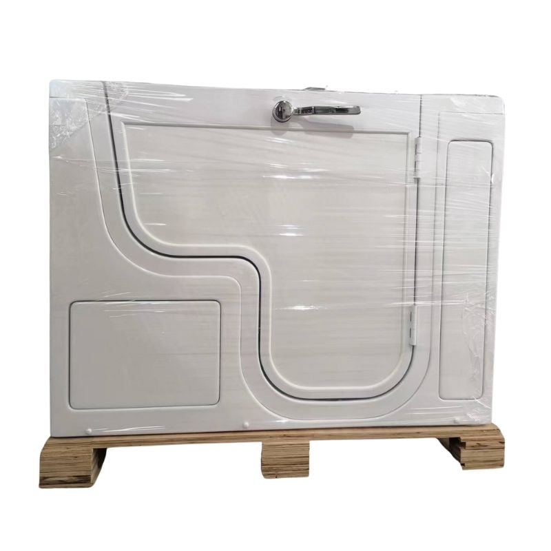 Ella walk-in tub wrapped in protective plastic on a wood shipping pallet showing the inward swing door with chrome handle