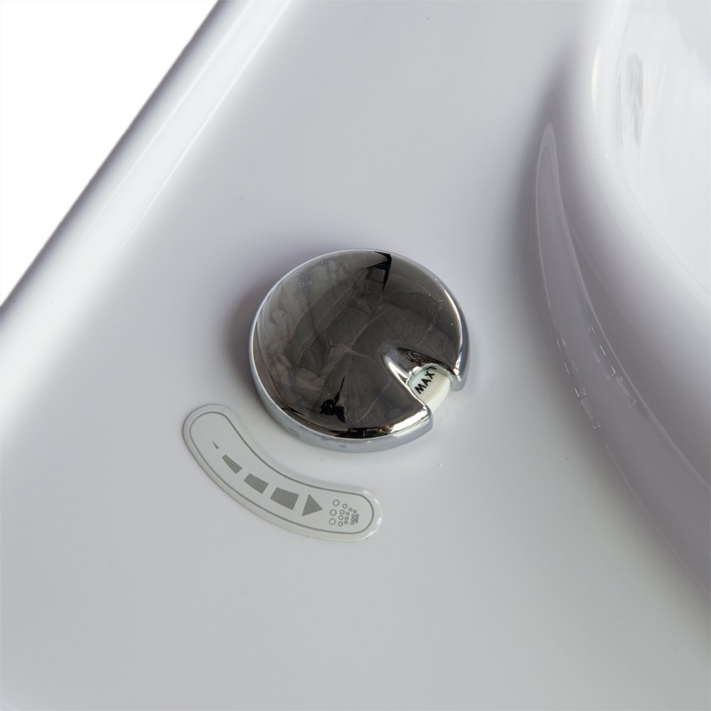 Close-up of a chrome flow rate control knob with jet intensity indicator label inside an Ella walk-in tub