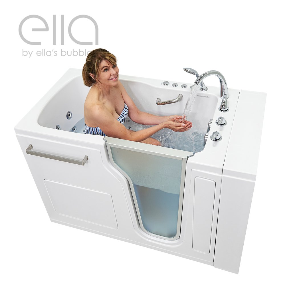 Woman smiling and testing warm running water inside the Ella Ultra walk-in tub with hydro jets and dual drain technology