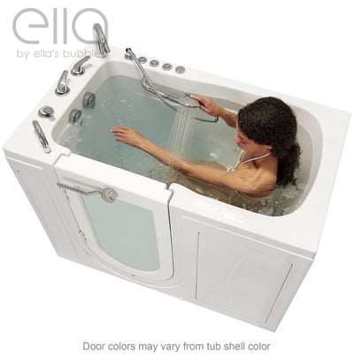 Woman using handheld showerhead while soaking in the Ella Monaco walk-in tub with hydro jets and outward swing door