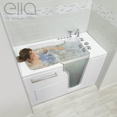 Woman reclining in bubbling hydro massage jets inside the Ella Ultra Acrylic walk-in tub with fast fill faucet and dual drain