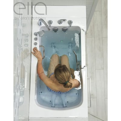 Overhead view of a woman soaking in the Ella Ultra acrylic walk-in tub with hydro jets and chrome faucet fixtures