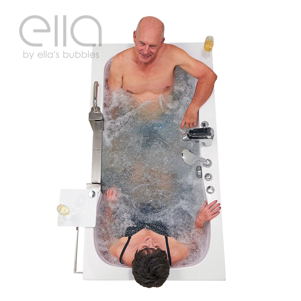 Aerial view of senior couple relaxing together in the Ella Companion two-seat walk-in tub with hydro jets and champagne glasses