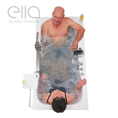 Aerial view of senior couple relaxing together in the Ella Companion two-seat walk-in tub with hydro jets and champagne glasses