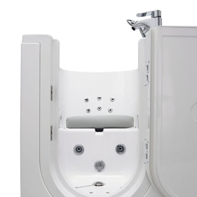 Front view of an Ella walk-in tub interior showing hydro jets, built-in seat riser, and chrome faucet with open door