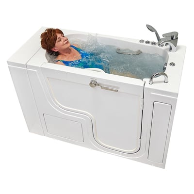 Senior woman relaxing with eyes closed enjoying hydro massage jets in the Ella Transfer 26 ADA accessible walk-in bathtub with outward swing door