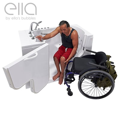 Person transferring from blue mobility aid into the Ella Transfer30 walk-in tub with wide outward-swing door open