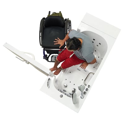 Overhead view of Person transferring into the Ella Transfer26 walk-in bathtub with outward swing door open wide