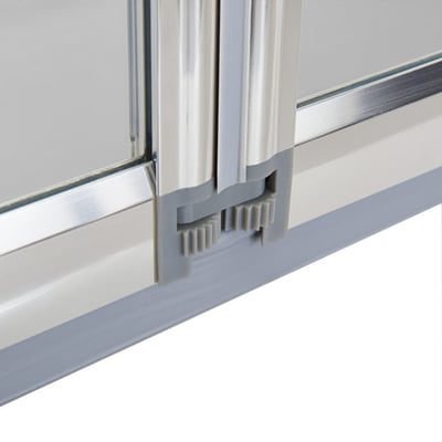 Close-up of gray rubber seal and aluminum frame on a 4-fold tempered glass shower screen for walk-in tubs