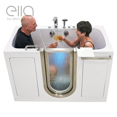 Senior couple laughing and toasting champagne together inside the Ella Companion two-seat walk-in tub with blue hydro jets active