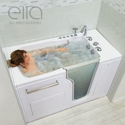 Woman relaxing with eyes closed enjoying a bubbling hydro massage in the Ella Ultra walk-in tub with dual drain technology