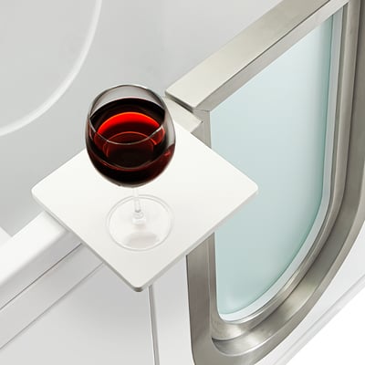 Royal Acrylic Walk-In Tub 32″x52″ (81x132cm) Dual Drain Technology - Close-up of a red wine glass resting on the Ella walk-in tub patented 360-degree swivel tray beside the door