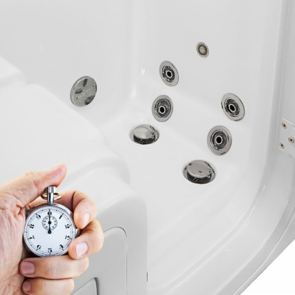 Hand holding a stopwatch next to an Ella walk-in tub interior showing multiple hydrotherapy jets and dual drain system