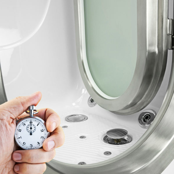 Hand holding a stopwatch next to an Ella walk-in tub dual drain system highlighting fast water drainage speed