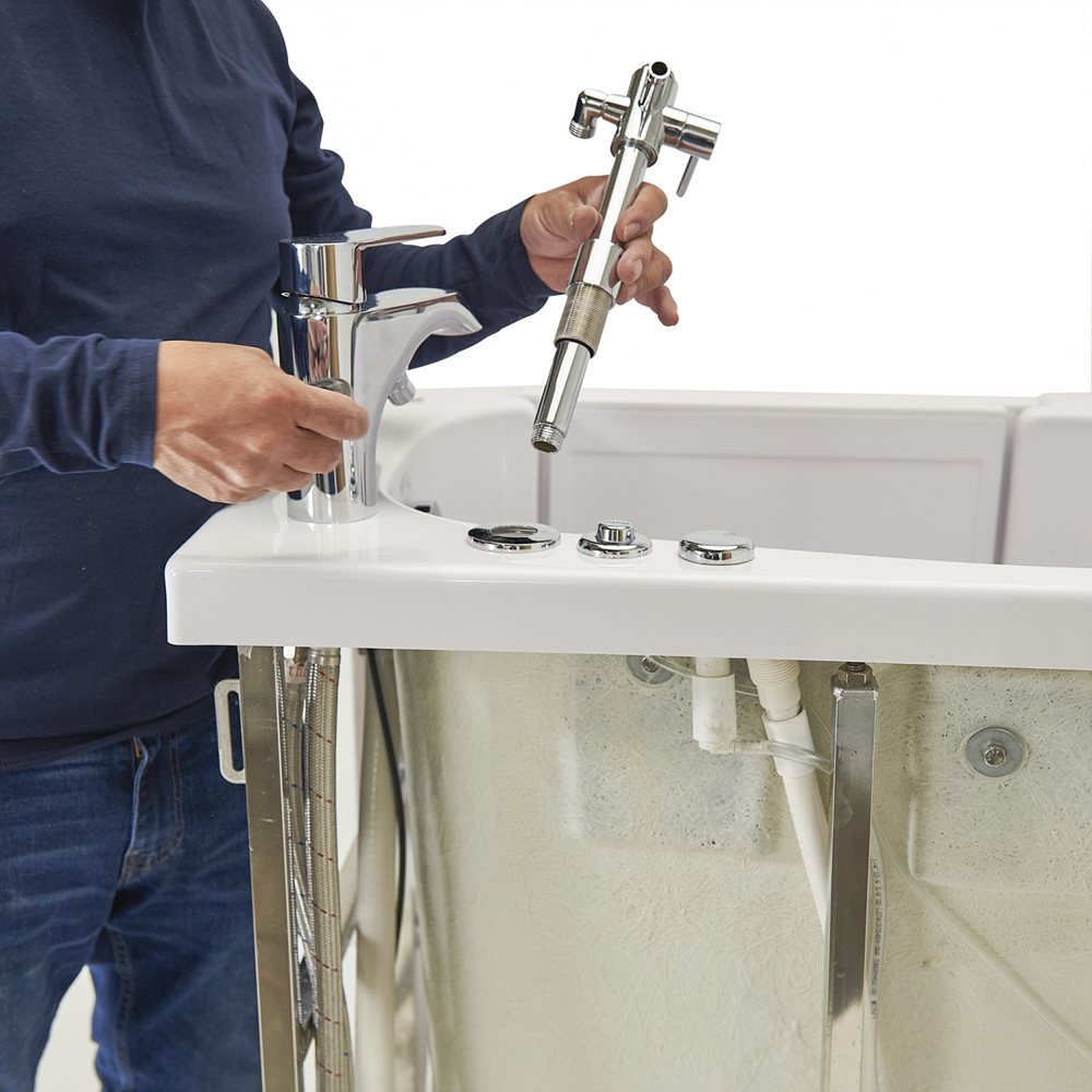 10″ Kit de tête de douche et colonne de douche pour robinets de baignoire encastrés dans le sol - %3E - Technician installing chrome faucet and handheld sprayer fixtures on an Ella walk-in tub deck during setup