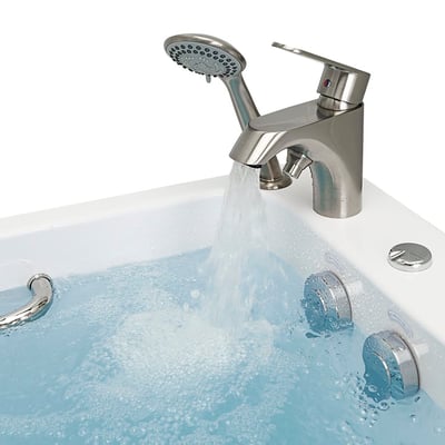 Close-up of brushed nickel single-lever fast-fill faucet with handheld showerhead filling an Ella walk-in tub with hydro jets