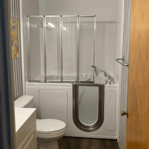 Walk In Tub Reviews Testimonials Feedback 23 Ella walk-in tub with glass door panel and folding shower enclosure installed in a white bathroom with dark wood floors