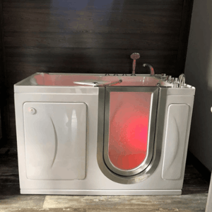 Walk In Tub Reviews Testimonials Feedback 24 Ella walk-in tub with red chromotherapy lighting glowing through the side entry door window on dark hardwood flooring