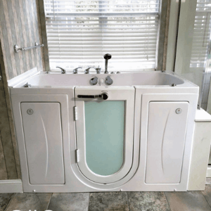 Walk In Tub Reviews Testimonials Feedback 65 White Ella walk-in tub with outward swing door and glass panel installed near a sunlit window in a tiled bathroom