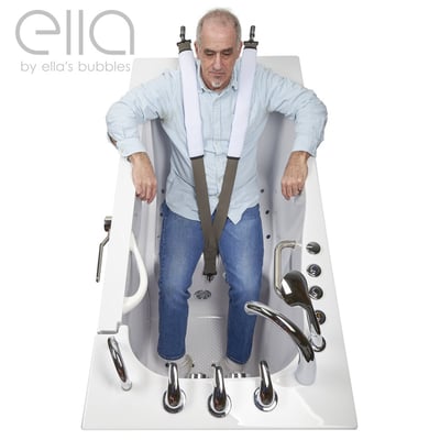 Senior man seated in an Ella walk-in tub wearing a padded safety body strap seat belt for stability and fall prevention