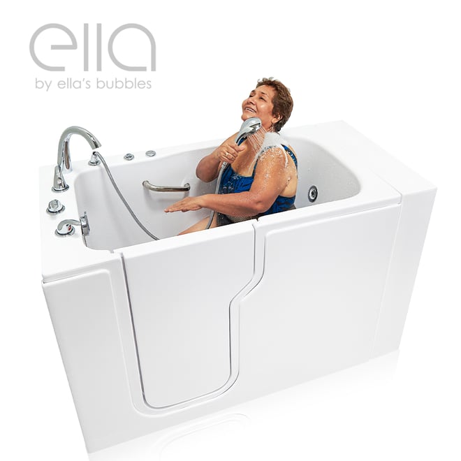 Senior woman laughing while using handheld showerhead inside the Ella Standard walk-in tub with hydro therapy massage jets