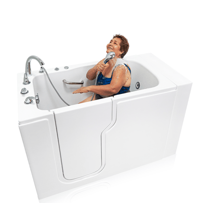 Senior woman laughing joyfully while using handheld showerhead inside the Ella Standard Acrylic Hydro Therapy walk-in bathtub