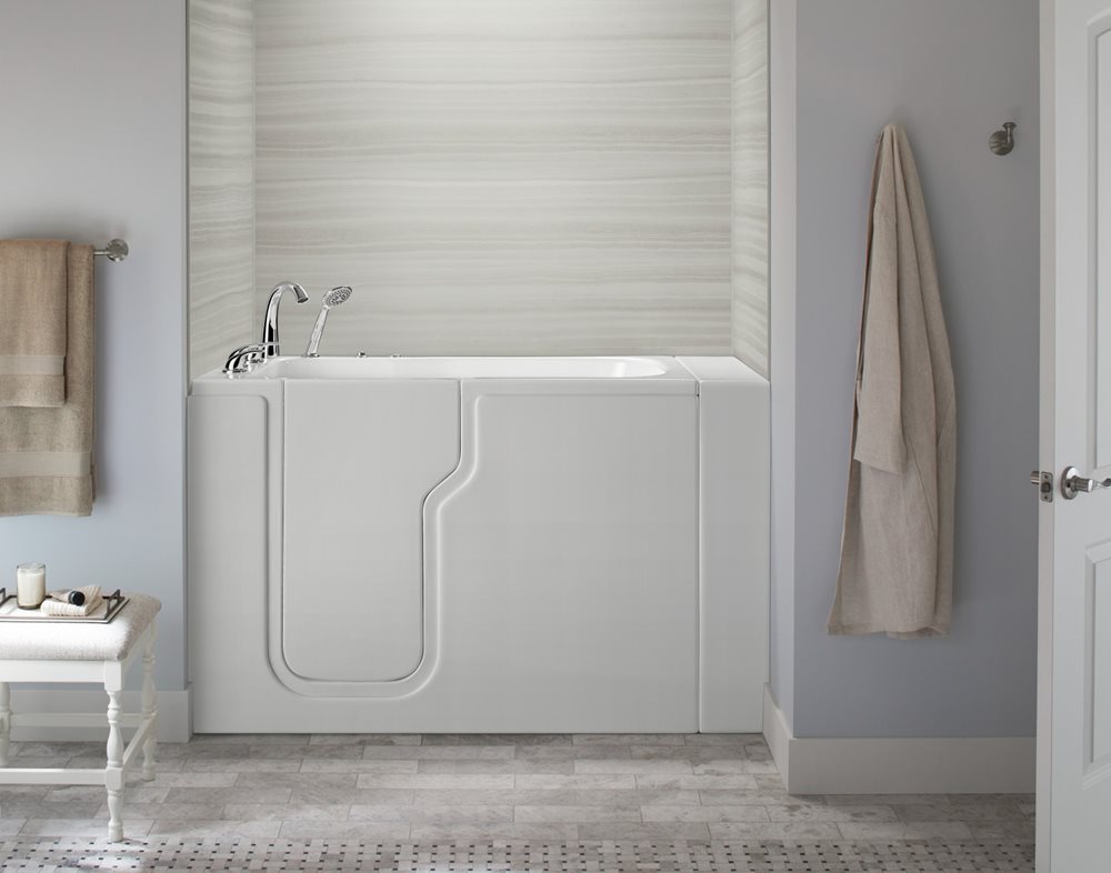White Ella Standard walk-in tub with glossy acrylic finish and chrome faucet in a bathroom
