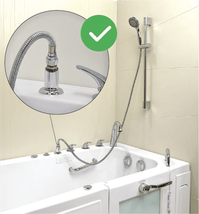 Leak Elimination Kit for Pull Out Hand Showers (5′ Hose with Barrel Connector) - Close-up callout of chrome faucet and flexible hose on an Ella walk-in tub with handheld showerhead on wall-mounted slide bar