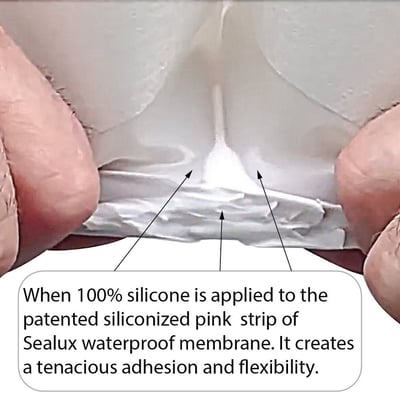 Close-up of hands stretching Sealux waterproof membrane showing 100% silicone adhesion and flexibility for walk-in tub installation
