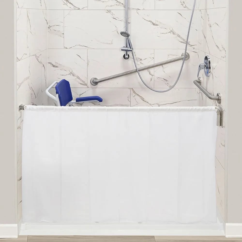 Ella caregiver half-height shower curtain on its rod in a roll-in shower with a fold-down seat and grab bars