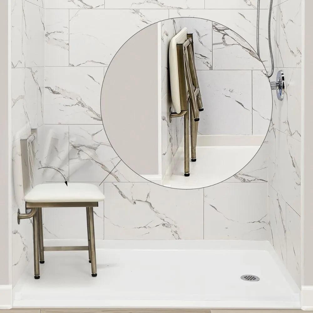 Ella fold-up shower chair shown open and folded flat against marble-look shower stall walls