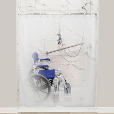 Weighted shower curtain on a rod over an accessible roll-in shower stall with a shower wheelchair and grab bars