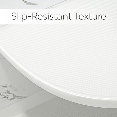 Close-up of white walk-in shower corner seat surface highlighting built-in slip-resistant texture for senior safety