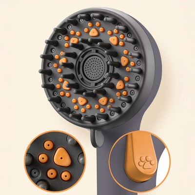 Close-up of a pet grooming handheld shower head with rubber massage bristles and a paw print button detail