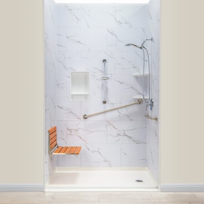 Ella accessible shower stall with marble walls, teak fold-down seat, grab bars, niche, and handheld showerhead