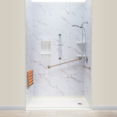 Ella accessible roll-in shower stall with marble walls, fold-up teak seat, grab bars, niche, and handheld showerhead