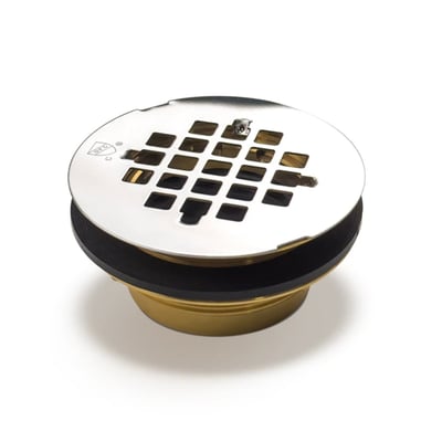 Round shower stall drain with polished chrome grid strainer top and brass base fitting on white background