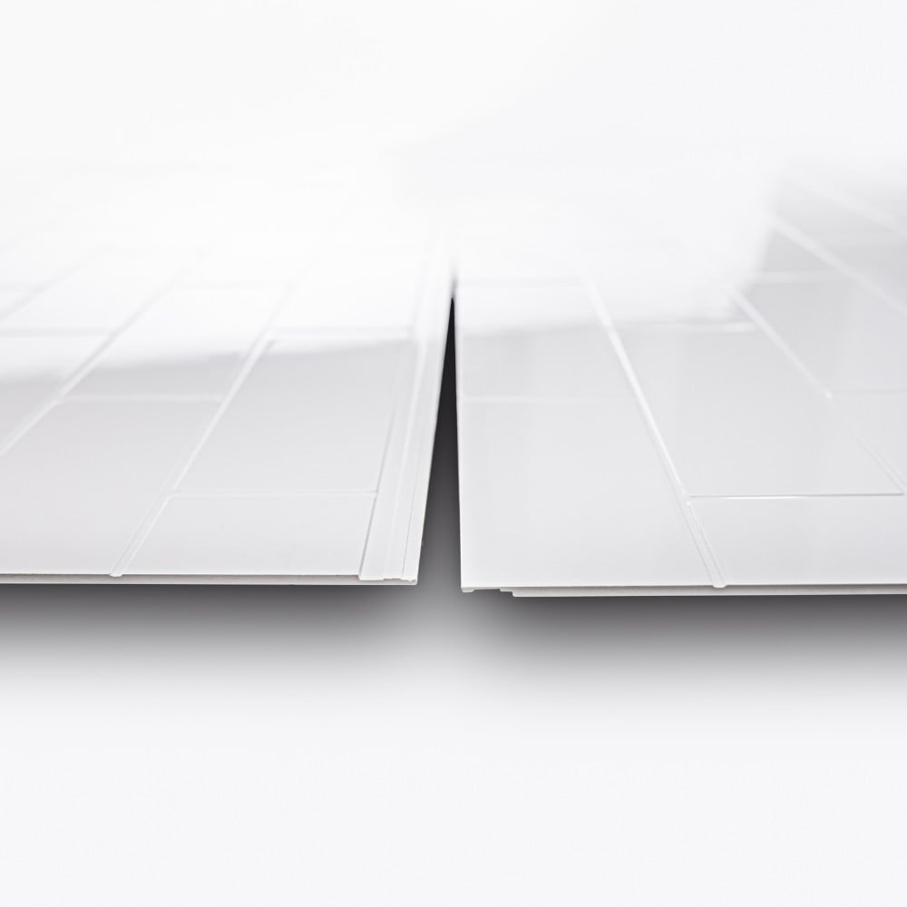 Two white SMC subway pattern shower wall panels showing the interlocking overlapping edges