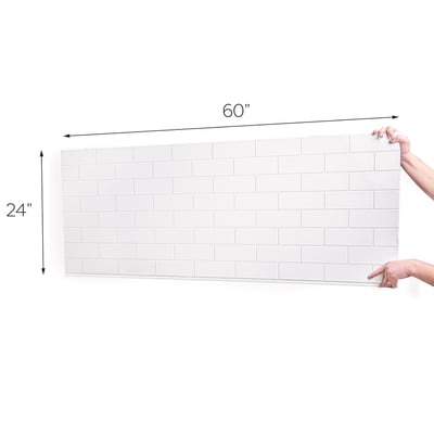 Hands holding a 60x24 inch white subway tile shower wall panel showing full dimensions against white background